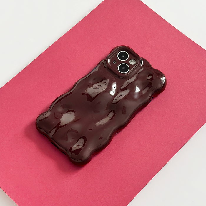 Burgundy 3D bubble phone case by Coconut Lane on a red surface with a white background.