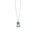 Gold-tone necklace with turquoise oval dangle pendant and three small teardrop accents