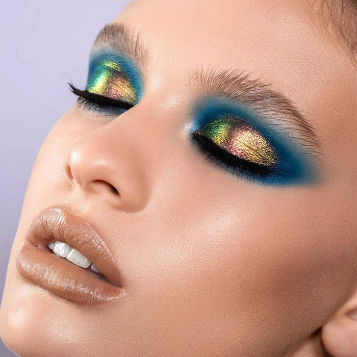 Chromium Liquid Eyeshadow model look on a gray background.
