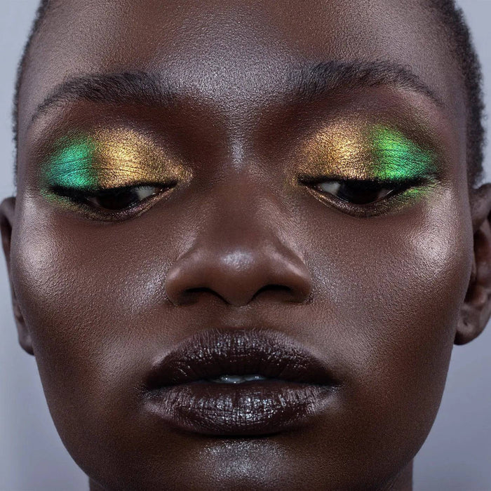 Chromium Liquid Eyeshadow model look on a gray background.