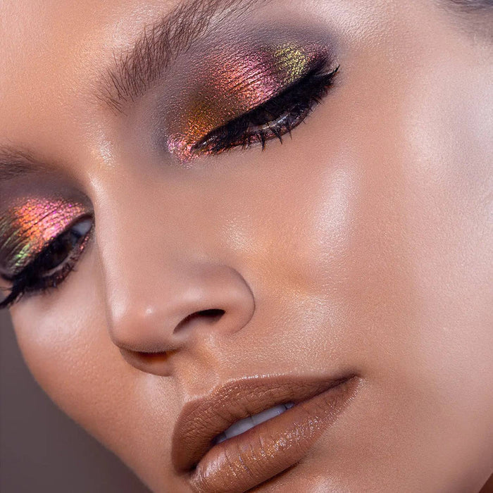 Chromium Liquid Eyeshadow model look on a gray background.