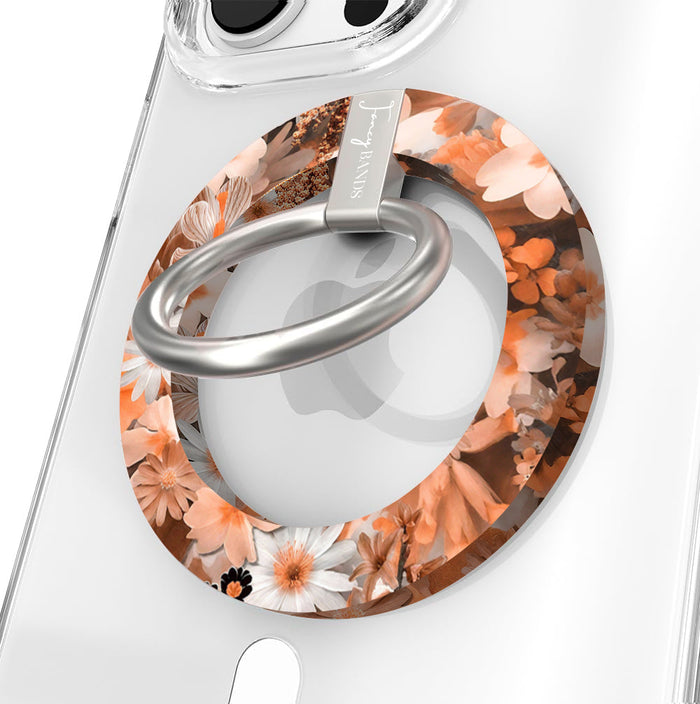 Fall Blooms Hold It Fancy MagSafe grip ring close-up on a clear iPhone case, showing the rust and cream autumn floral print around the silver rotating metal ring.