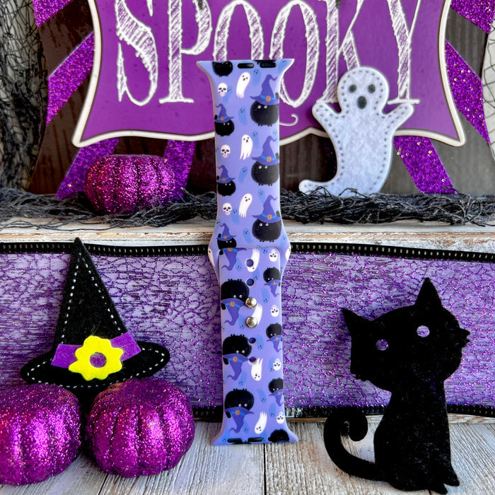 Single Ghostly Whisker's Apple Watch band strap standing to show black cats and tiny skulls running the full length of the lavender silicone.