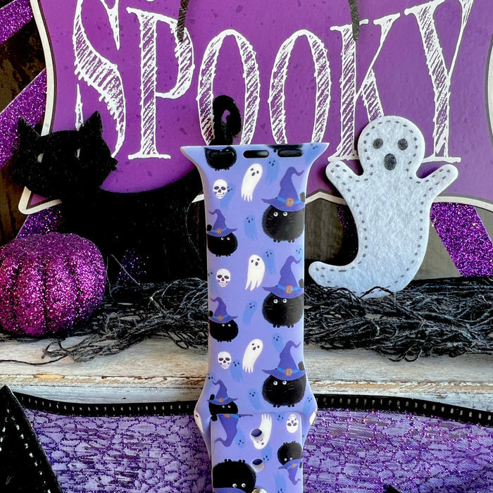 Close-up of the Ghostly Whisker's Apple Watch band top with a white felt ghost behind it, showing print detail on soft lavender silicone.