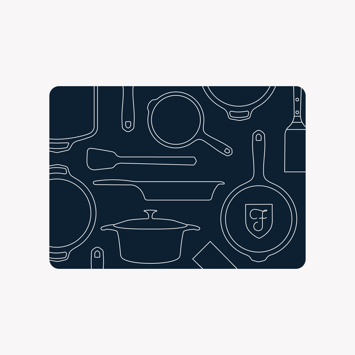 Field Company gift card in navy with white line drawings of skillets, a Dutch oven, and kitchen tools