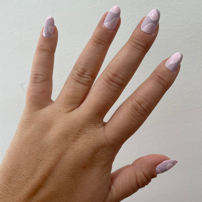 Groovy Swirl - Press-On | Short | Round pink and lavender round false nails with swirling design for easy at-home mani