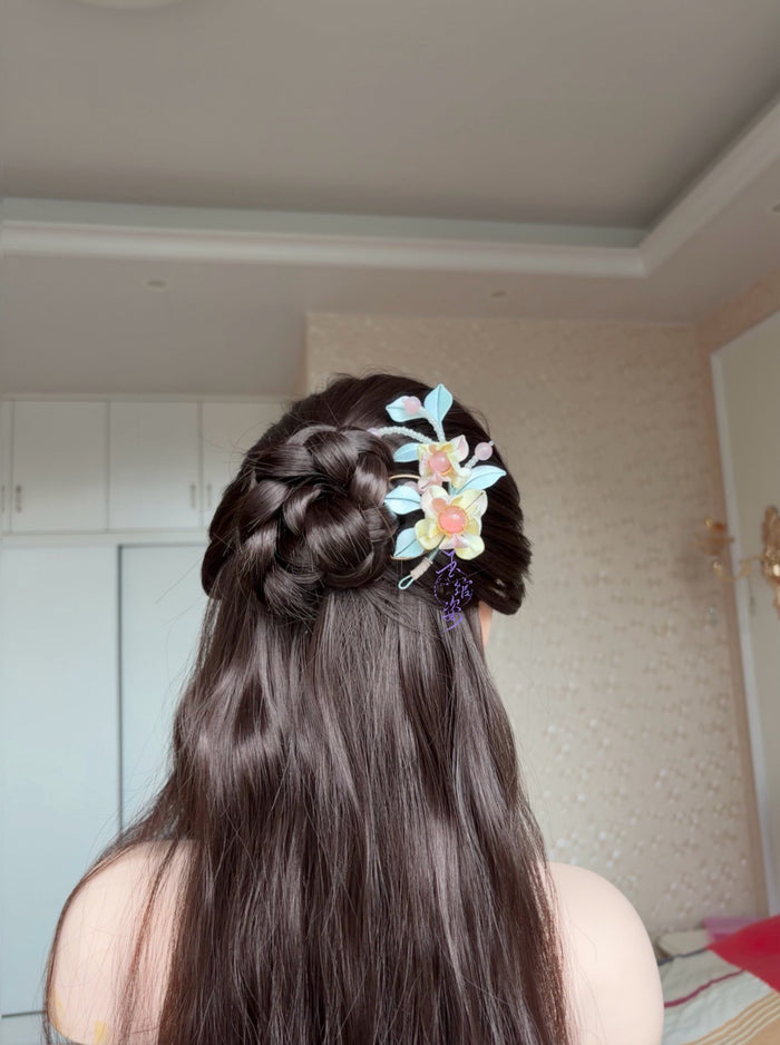 Pink - blue handmade Chanhua hairpin adorning a woman's hairstyle-2