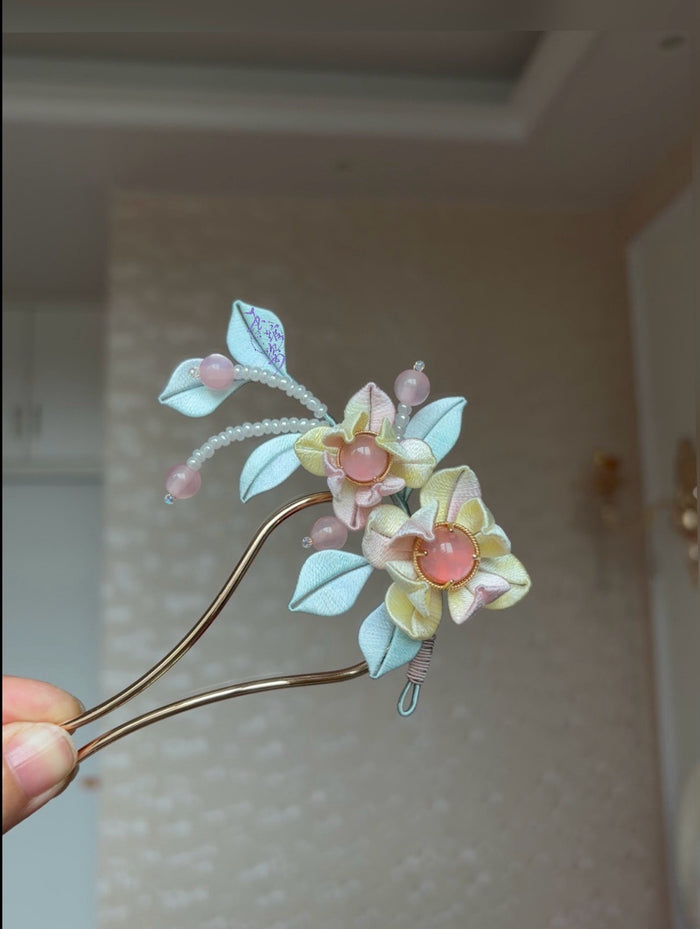 Pink - blue handmade Chanhua hairpin adorning a woman's hairstyle-3