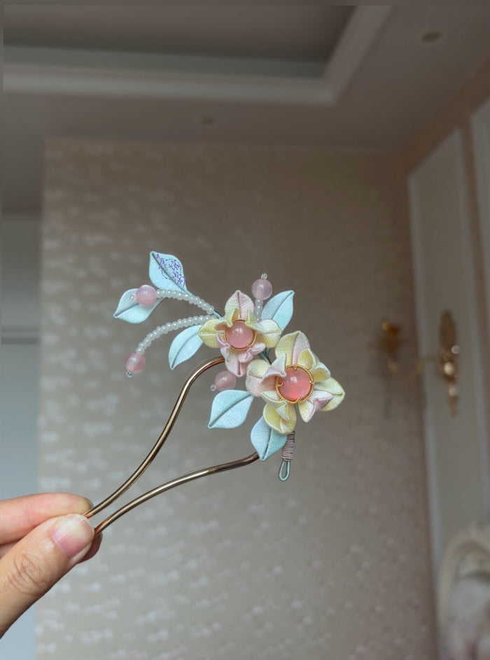 Pink - blue handmade Chanhua hairpin adorning a woman's hairstyle-4