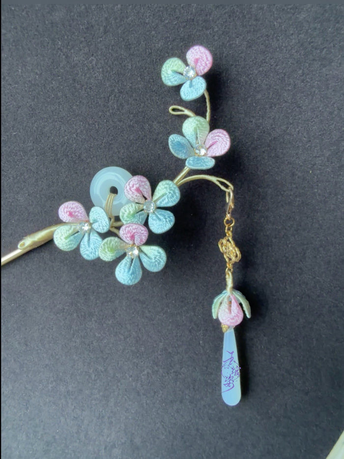 A handmade Chanhua hydrangea - styled hairpin with pastel - colored petals and a tassel-2