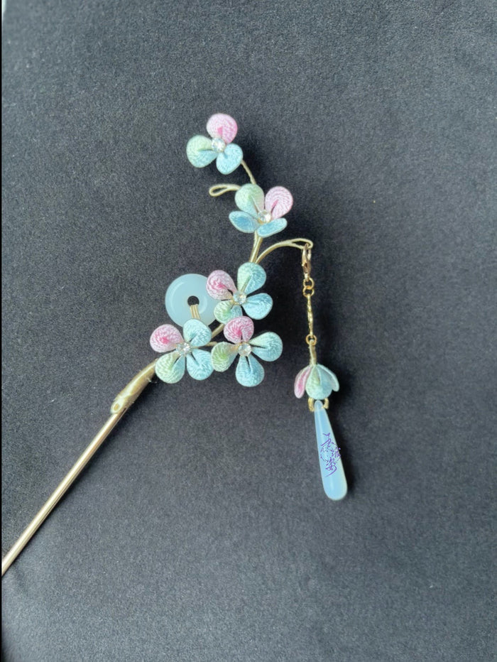 A handmade Chanhua hydrangea - styled hairpin with pastel - colored petals and a tassel-5