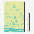 ISLA SIRENA Eau de Parfum 1.5ml vial next to green ISLA SIRENA vial holder card with blue drawn images of birds, a mountain, a mermaid sitting on a rock, water ripples, and the Ellis Brooklyn literary lion logo and blue text that reads 'Ellis Brooklyn ISLA SIRENA Eau de Parfum'