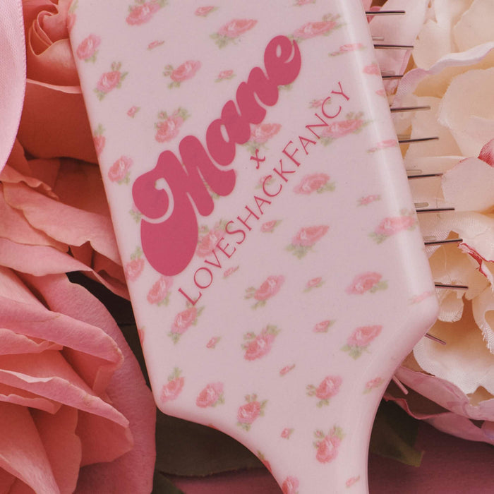 Back of the mane x love shack fancy collab mini detangling brush.