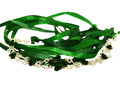 Silver wire ribbon crown with green roses and green ribbon ties on white background