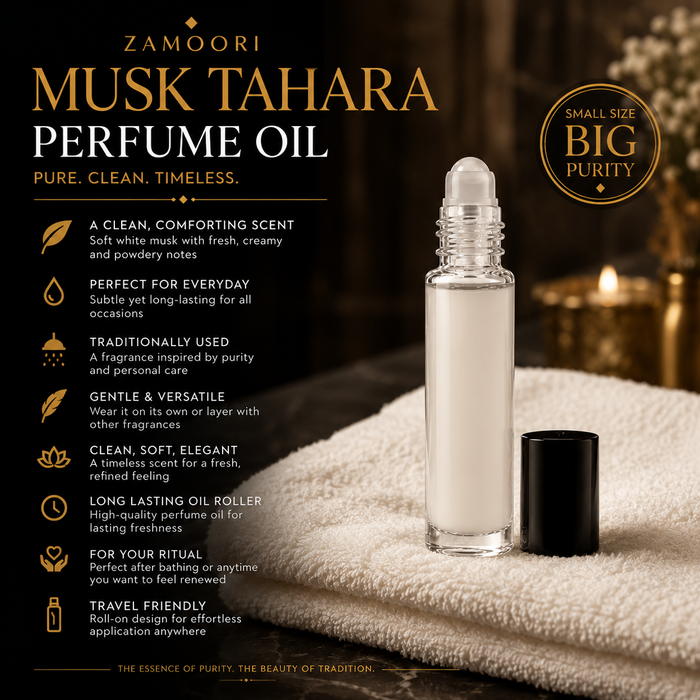 Zamoori Musk Tahara Perfume Oil in a clear glass roller bottle with its black cap placed beside it on a textured cream towel. The background is a warm, dark, atmospheric setting with blurred candles, and the left side features descriptive text highlighting the product's clean, comforting scent and traditional use.