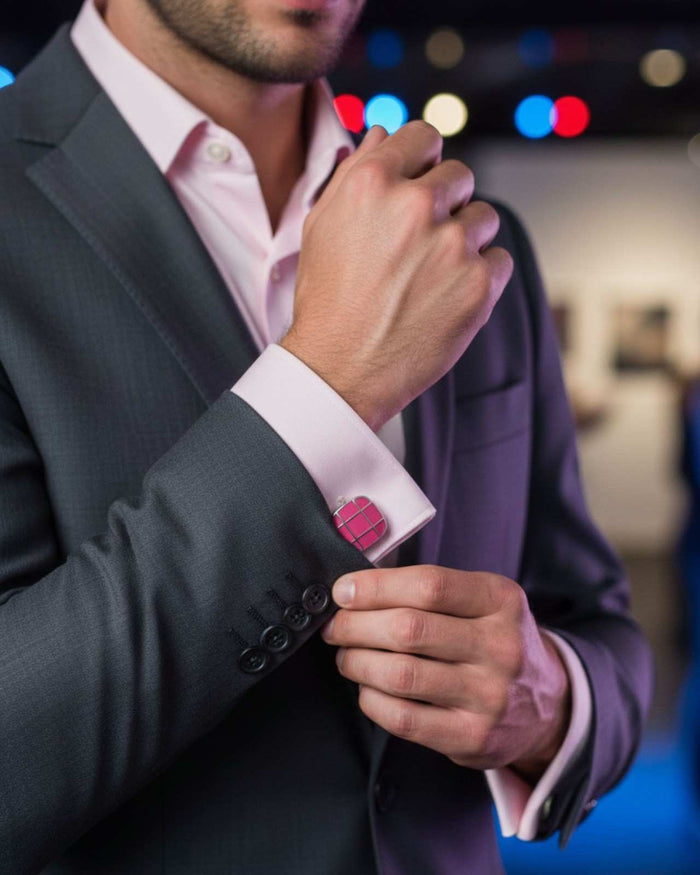 Square pink grid enamel cufflinks on shirt cuff with silver posts