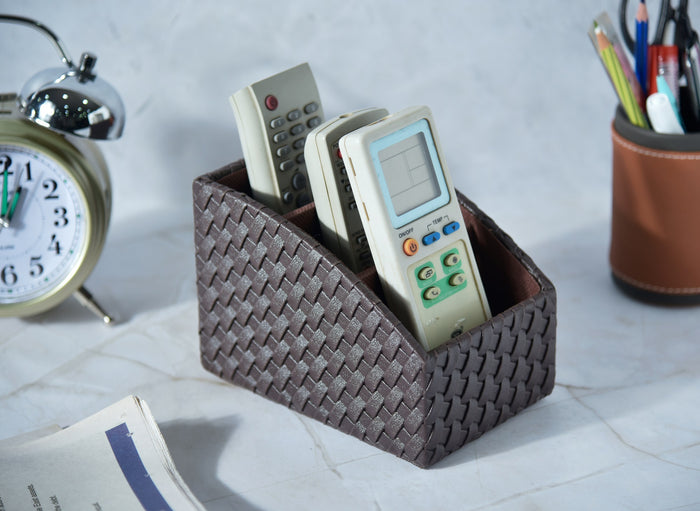 Woven remote holder with three curved compartments, dark brown zigzag braid exterior