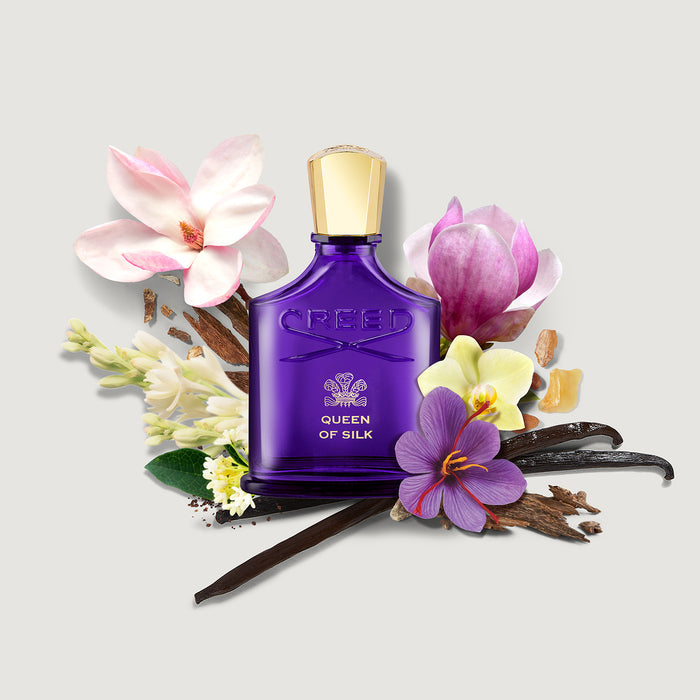 Creed Queen of Silk creed purple bottle with magnolia saffron vanilla notes - Ingredient Flat Lay | Creed Fragrances