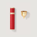 Red Leather & Gold 10ml Refillable Travel Atomiser with Funnel - Flat Lay | Creed Fragrances