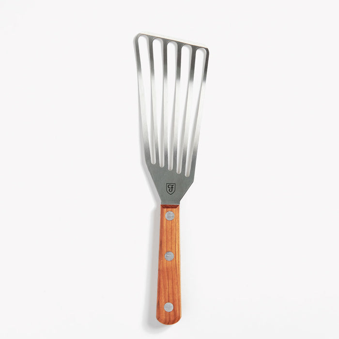Left-handed Field Slotted Turner with slotted stainless blade and riveted wood handle on a white background