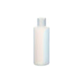 White bottle with a cap on a white background