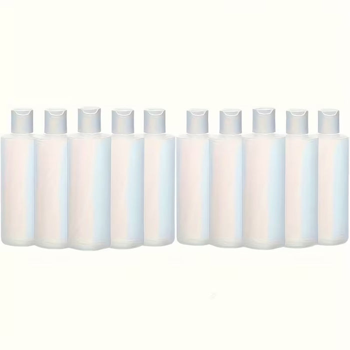 Row of white bottles with caps on a white background