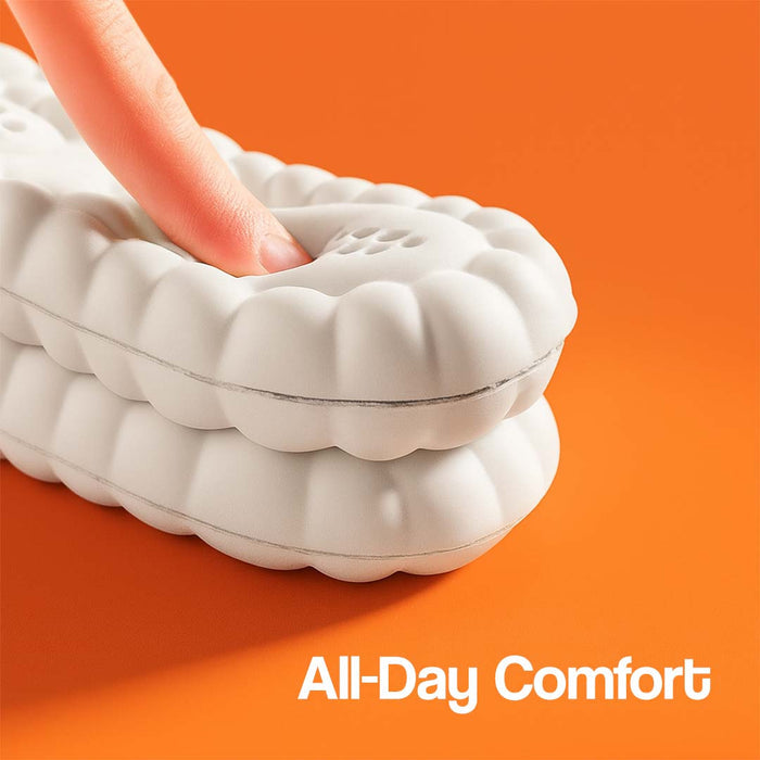 White massage insole with textured surface, finger pressing down, on an orange background.