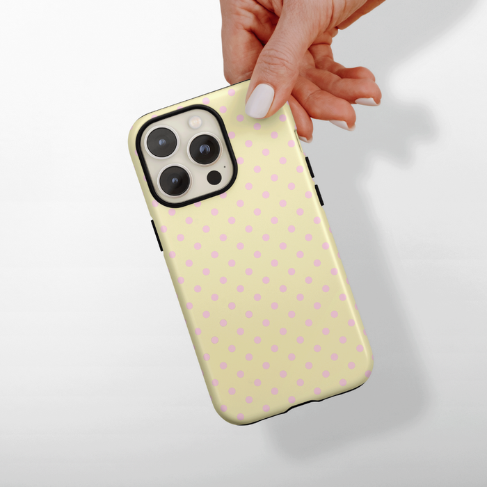 Pale yellow Phone Case mockup with baby pink polka dots.