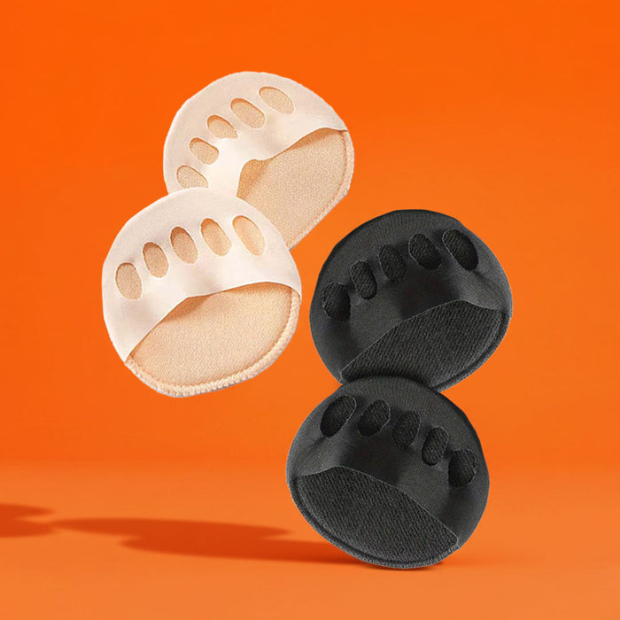 A textured grey and gold foot massage roller stands upright on an orange floor.