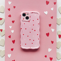 Pink wavy phone case with a pattern of red and white hearts.