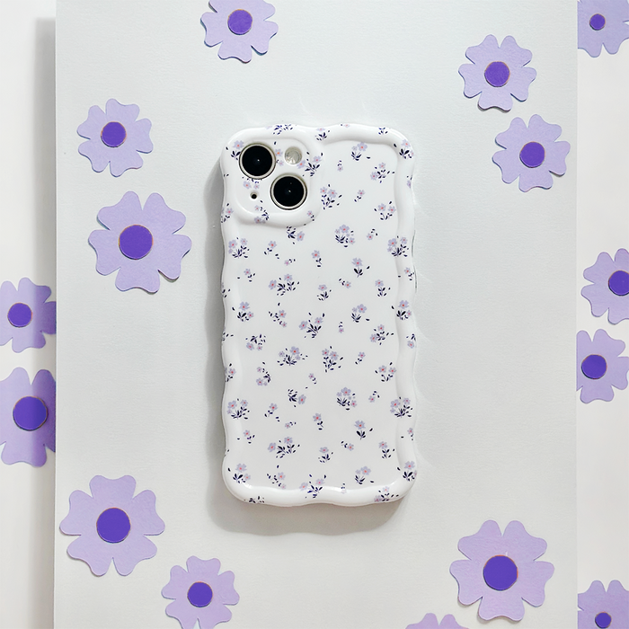 Wavy phone case with purple floral pattern and cutouts on a white background.