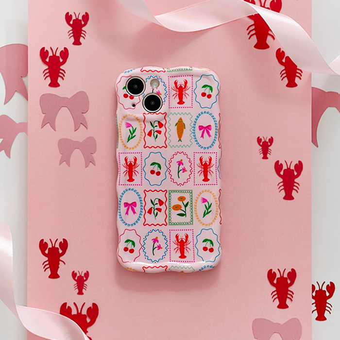 Coconut Lane Dolce Vita wavy phone case with pastel pattern on pink paper, next to lobster and bow cutouts.
