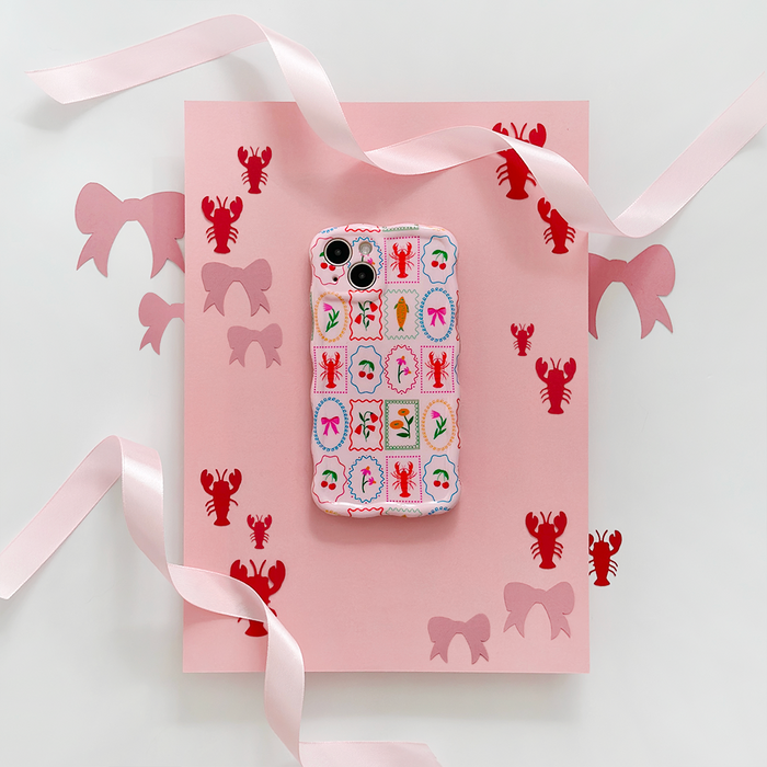 Pink wavy phone case with lobster, bow, and ribbon motifs in a playful stamp-style pattern.