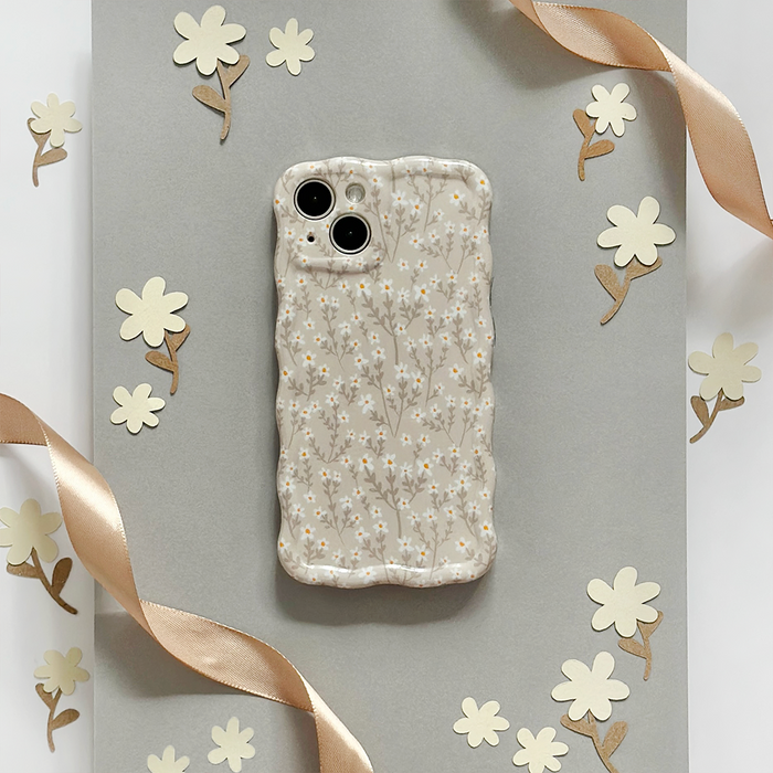 Wavy phone case with beige floral pattern on gray and a satin ribbon accent, by Coconut Lane.