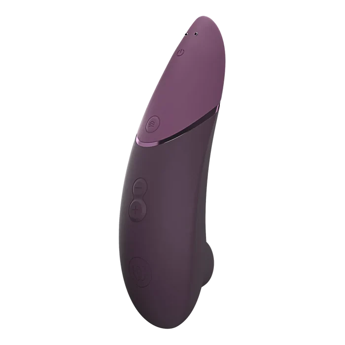 Mørk lilla Womanizer NEXT enhet med matte overflate og metallstripe