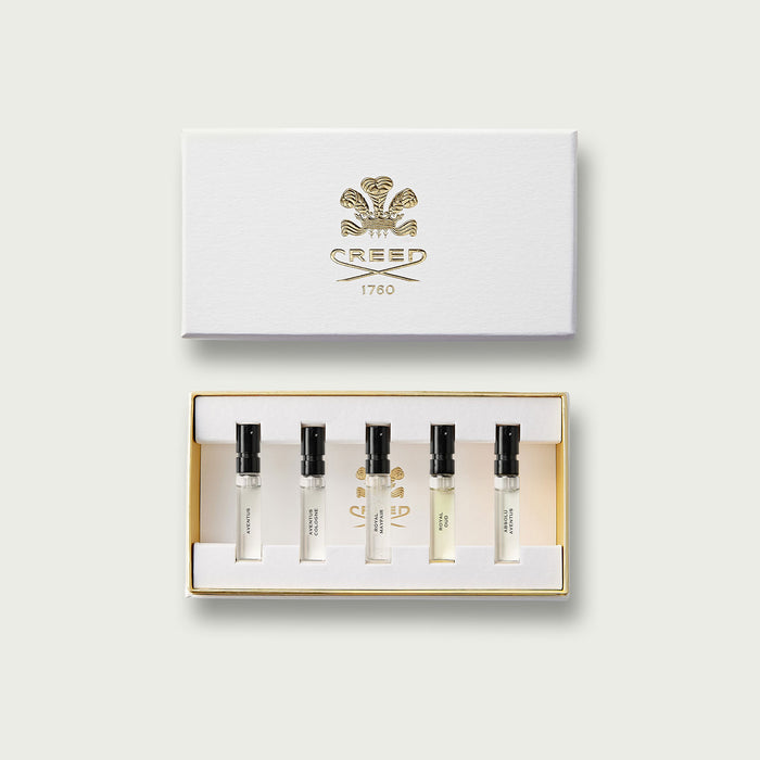 Woody Inspiration Sample Set with gold-embossed white box and five fragrance vials - Flat Lay | Creed Fragrances
